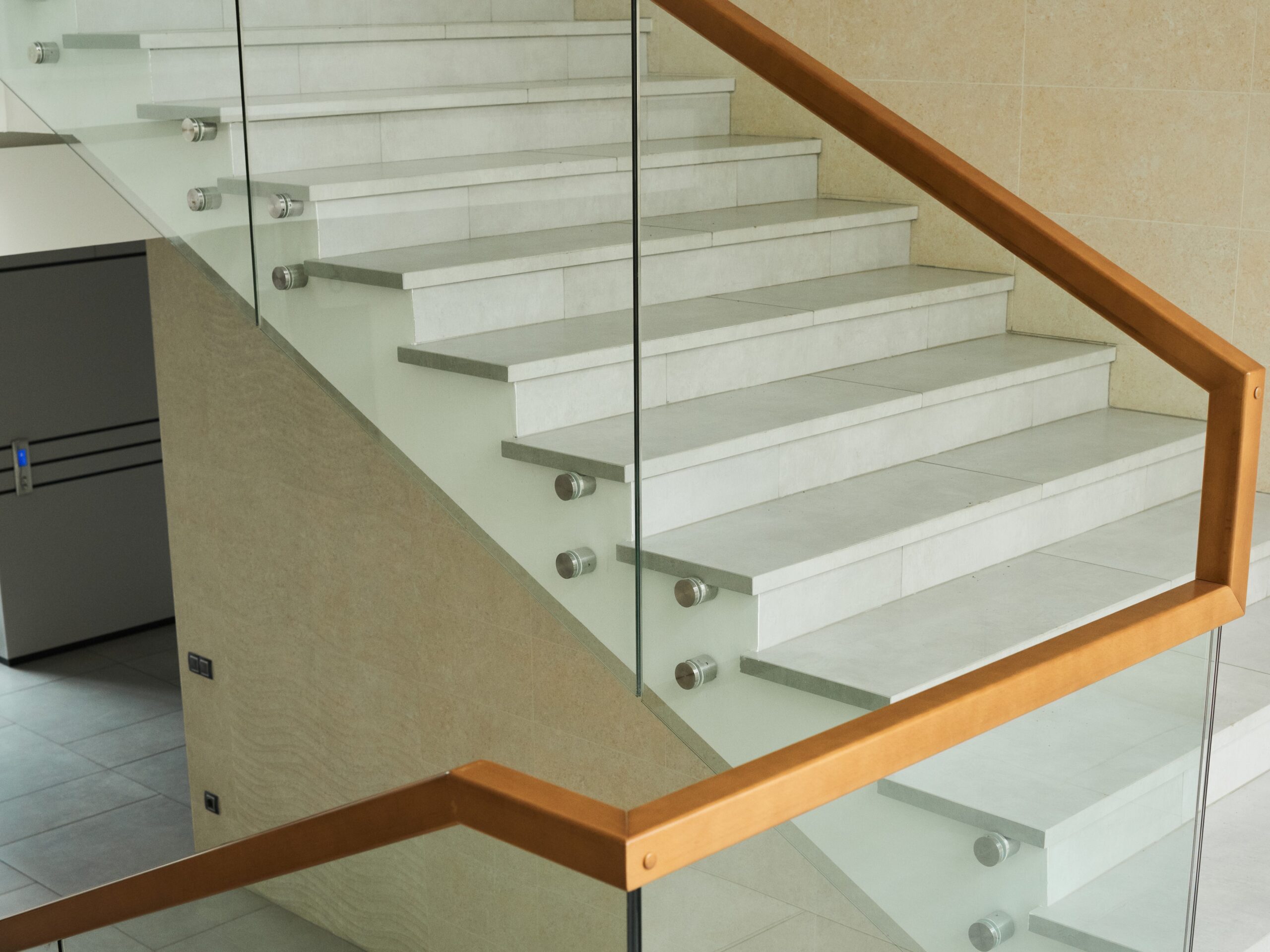 Image of stairs with glass railing in modern office building