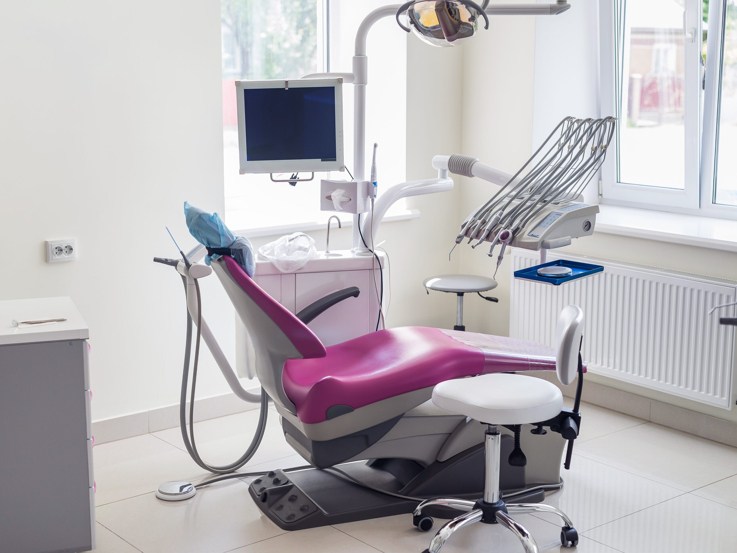 Dentistry inside, violet chair for patient and equipment