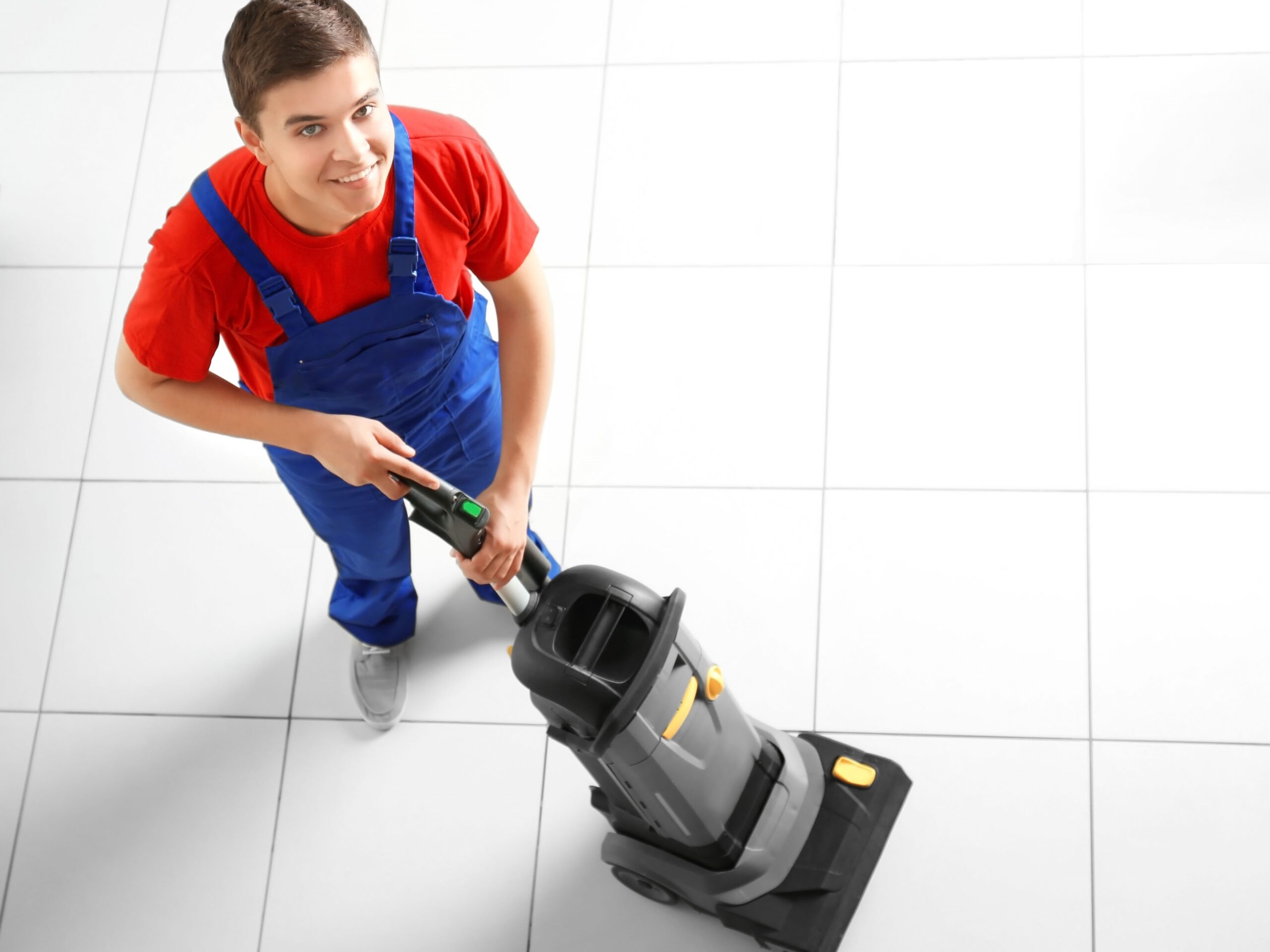 Man vacuuming floor, top view