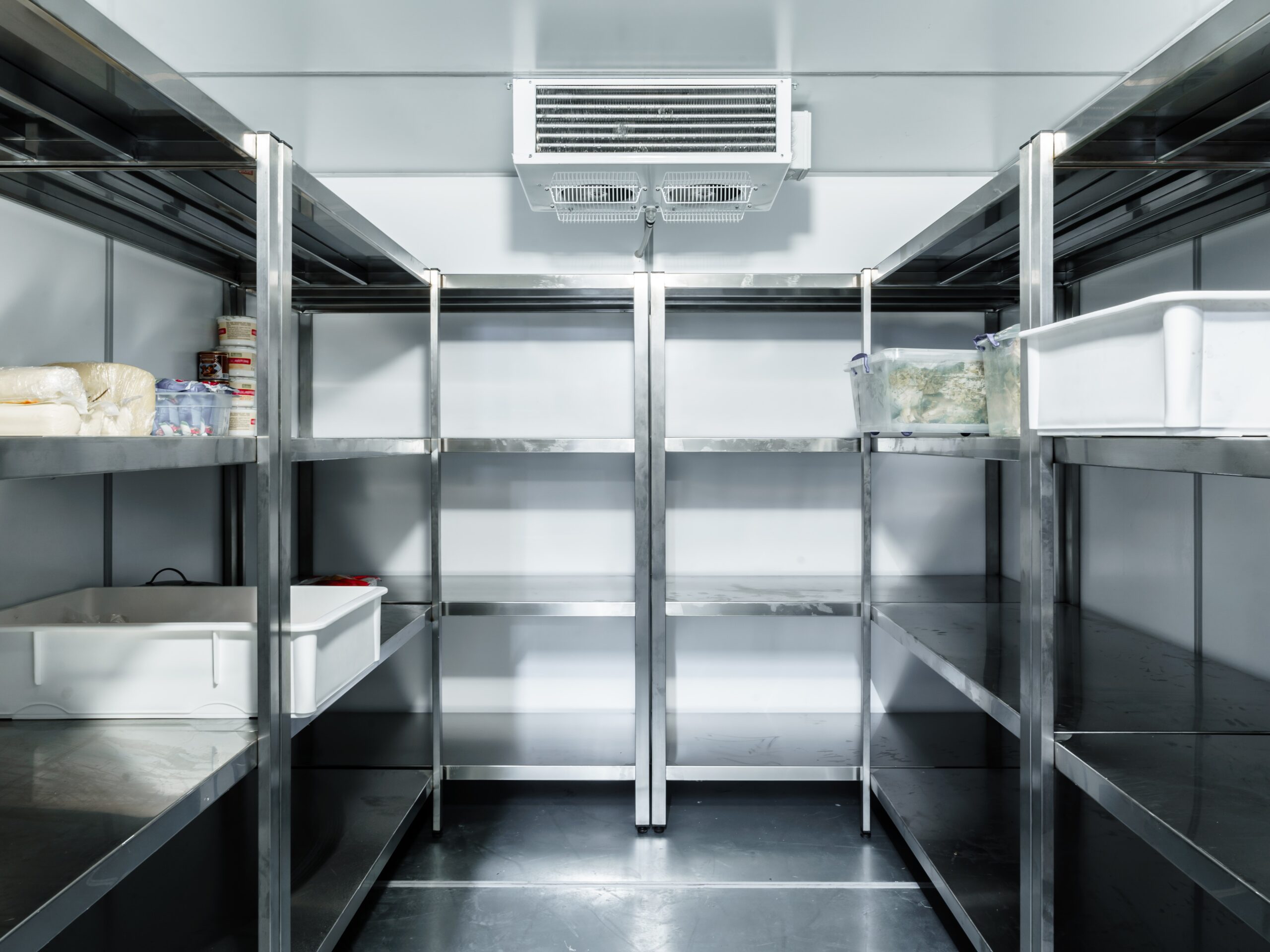 Refrigerator chamber with steel shelves in a restaurant